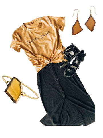 Gold shirt, black skirt, and gold earrings and cuff