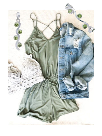 Green romper with jean jacket and green multi-gem jewelry