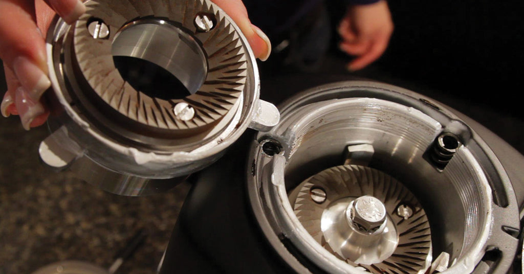 Burrs outside of a taken-apart grinder