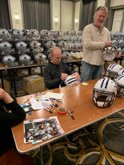 Roger Staubach signing Flat White Helmet