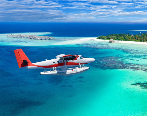 Plane flying over the maldives