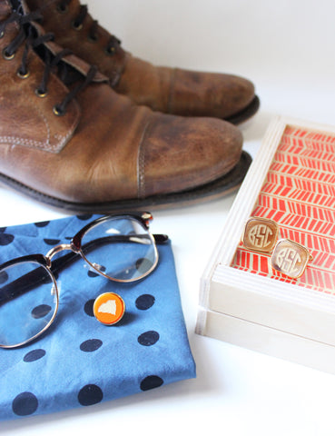 Moon and Lola - lapel pin and cufflinks next to brown hightop oxford boots