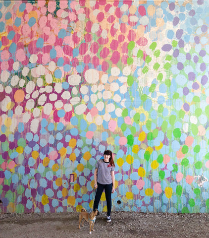 moon and lola taylor lee in front of huge canvas