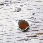 Orange/brown sea glass pendant