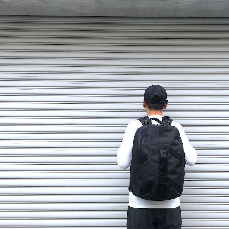 -〔UNISEX〕- WHITE MOUNTAINEERING BLK ホワイトマウンテニアリング 　　 WM × BRIEFING BACK  PACK