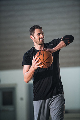 Kevin Love Holding Basketball