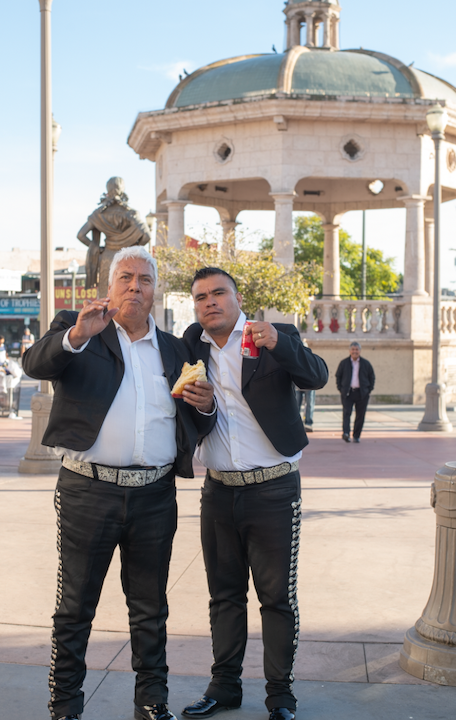 Two Mariachi Members enjoying a piece of the Rosca de Reyes 