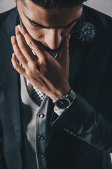 Worried looking man in a suit contemplates fear of panic attacks