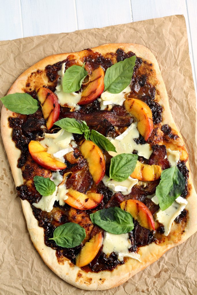 Pizza Topped with Brie Cheese, Grilled Peaches and Basil