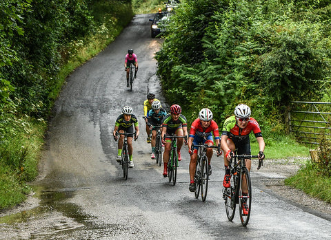 Female Cyclists uphill
