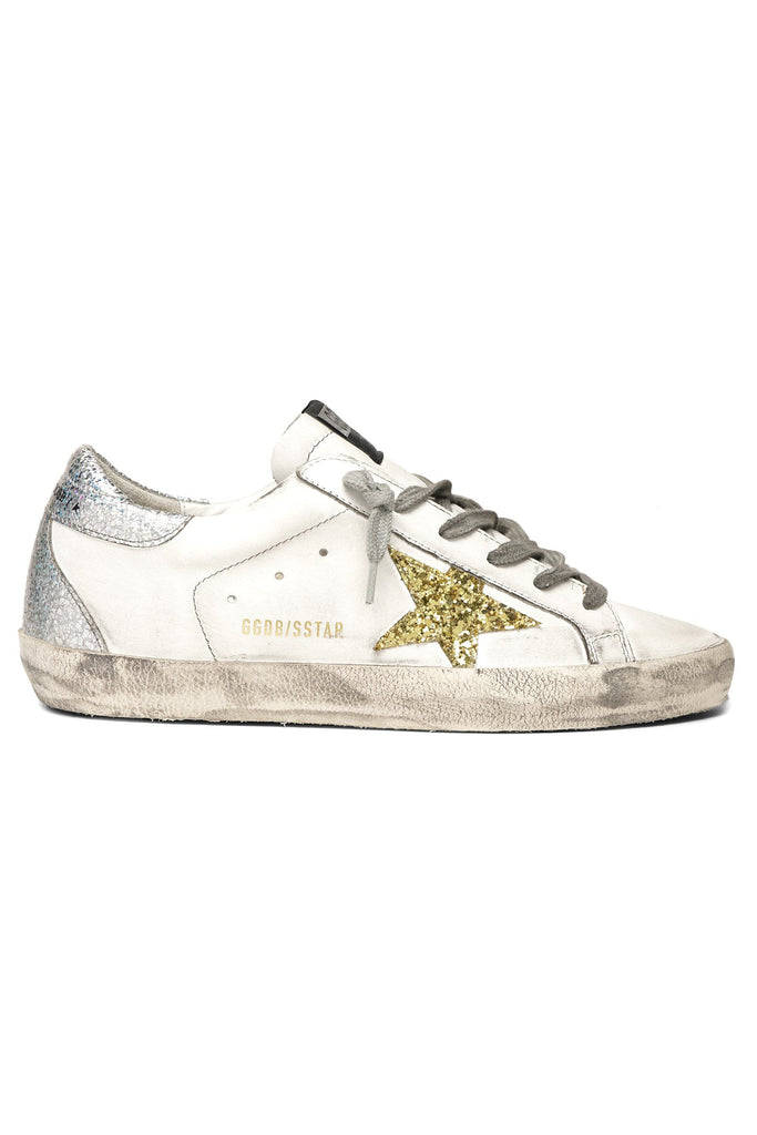 white sneakers with gold stars