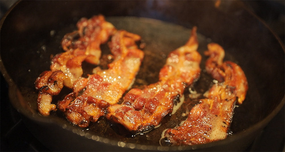 frying bacon in the lancaster cast iron skillet