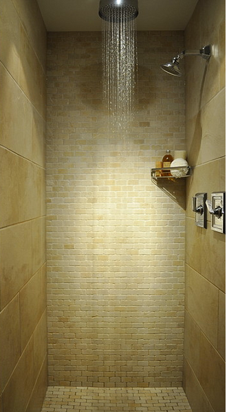 small but clean and organized shower with floating shower shelf, rain shower head, beige wall tile and mosaics... 5 Steps to Make Your Small Shower Look Bigger Without Remodeling from Bathroom Bliss by Rotator Rod 