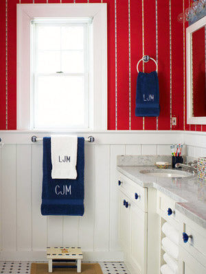 red and white striped bathroom walls with white wainscoting, white and blue towels, white cabinets... American Inspired Red, White & Blue Bathrooms from Bathroom Bliss by Rotator Rod