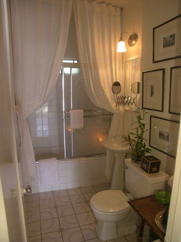 small but beautiful white bathroom with double white shower curtains... Bathroom Decor Ideas: Luxurious Shower Curtains from Bathroom Bliss by Rotator Rod