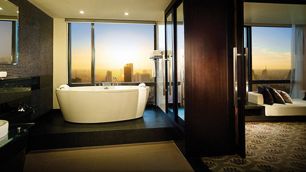 luxurious bathroom with freestanding bathtub, dark wood and tile accents and downtown Bangkok, Thailand, view... Beautiful Bathroom Inspiration: Big City Style