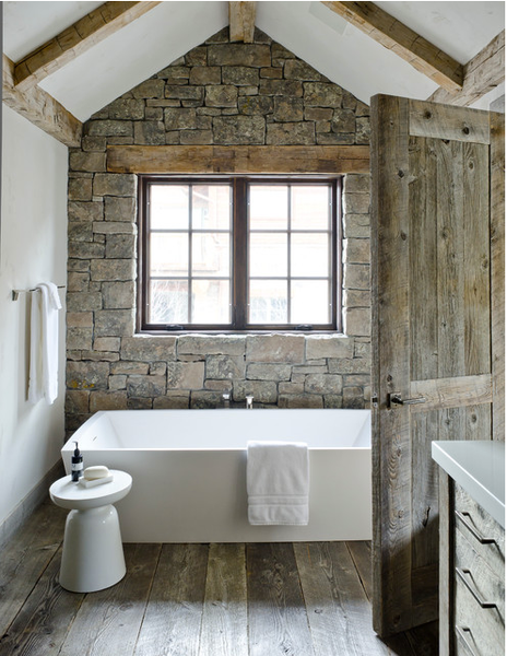 beautiful bathroom with wood floors, exposed beams, country door, rough stone wall, and modern bathtub... Beautiful Bathroom Inspiration: Contemporary Rustic Design from Bathroom Bliss by Rotator Rod