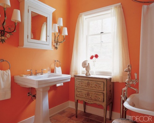 orange bathroom balanced with white accessories and curtains... Beautiful Bathroom Inspiration: Orange Bathrooms from The Bathroom Bliss Blog by Rotator Rod, the original curved shower rod that rotates!