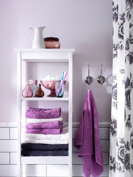 white and gray bathroom with subway tile and fun purple accents, towels, shower curtain... Hottest Space-Saving Bathroom Trends for 2015 from The Bathroom Bliss Blog