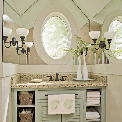 big beautiful guest bathroom with mirrors, granite, green cabinet with exposed shelves... Prepare for Holiday House Guests with a Well Stocked Guest Bathroom from The Bathroom Bliss Blog by Rotator Rod