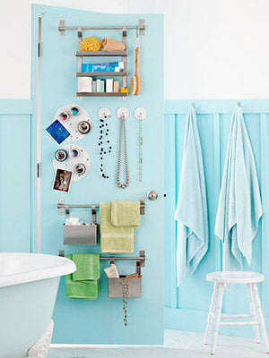 stylish light blue small bathroom with clever storage solution of putting hooks on the back of the door... Inspiration in Rotation: Summer-Inspired Bathrooms from Bathroom Bliss by Rotator Rod