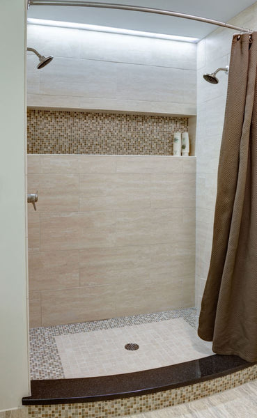 luxurious beige shower with built in shelf & curved shower rod... Quick Fix Bathroom Ideas: Expand Shower Space Easily with a Curved Shower Rod from Bathroom Bliss by Rotator Rod