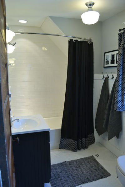 beautiful black & white bathroom with a curved shower curtain rod... Quick Fix Bathroom Ideas: Expand Shower Space Easily with a Curved Shower Rod from Bathroom Bliss by Rotator Rod