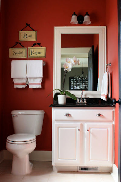 small traditional bathroom with dark red walls and white accents... Red Bathroom Inspiration from Bathroom Bliss by Rotator Rod