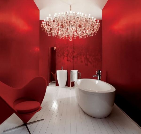 modern red and white bathroom with oval freestanding bathtub, red winged chair, white tile floor, amazing chandelier... Red Bathroom Inspiration from Bathroom Bliss by Rotator Rod
