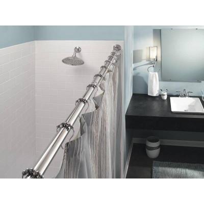 serene blue bathroom with black vanity, straight shower rod, striped shower curtain... Should You Change Your Shower Rod for Winter? from Bathroom Bliss by Rotator Rod