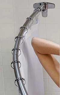 you can see the elbow space you gain in the shower with a curved shower rod... Should You Change Your Shower Rod for Winter? from Bathroom Bliss by Rotator Rod