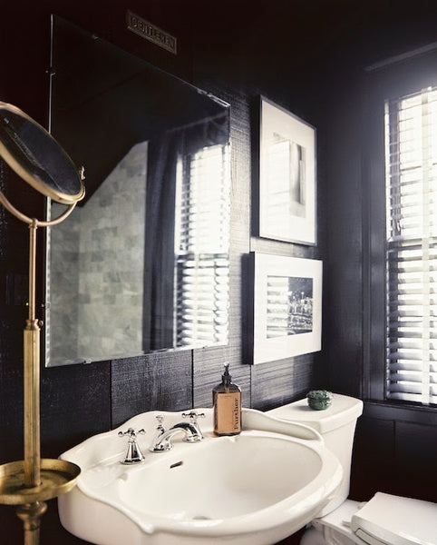 masculine bathroom with porcelain sink, artwork, and gold accents... Sleek & Sexy Black Bathroom Designs from Bathroom Bliss by Rotator Rod