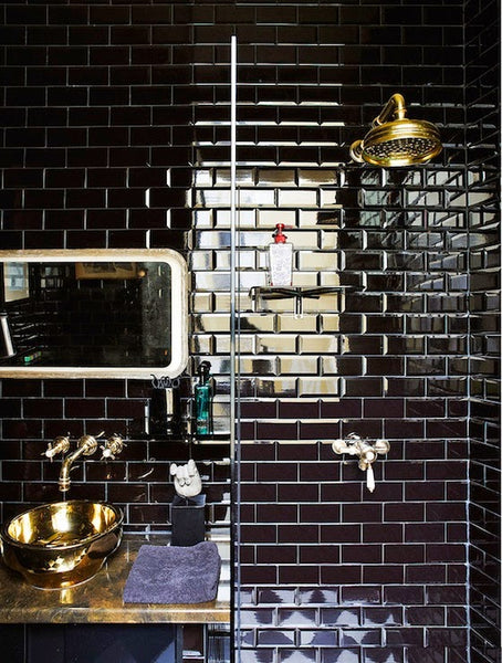 gorgeous bathroom shower with glossy black tile and gold accents... Sleek & Sexy Black Bathroom Designs from Bathroom Bliss by Rotator Rod