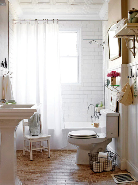 small white and airy bathroom with white shower curtain, wood floor... Small Bathroom Ideas: Shower Spaces from Bathroom Bliss by Rotator Rod