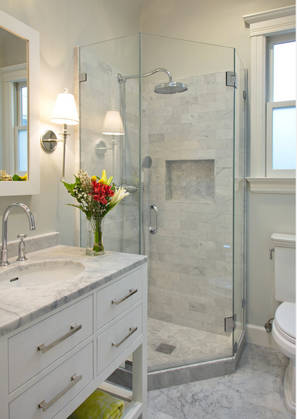 small white bathroom with marble tile, white cabinets, glass shower doors, flowers... Small Bathroom Ideas: Shower Spaces from Bathroom Bliss by Rotator Rod