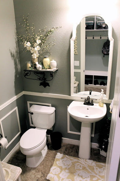 gray bathroom with white accents, large white framed mirror, pedestal sink and decorative shelf... Small Bathroom Ideas: Trendy Bathroom Mirror Updates from Bathroom Bliss by Rotator Rod
