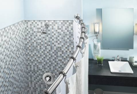 serene light blue bathroom with a curved shower rod... Straight Vs. Curved Shower Rods from Bathroom Bliss by Rotator Rod