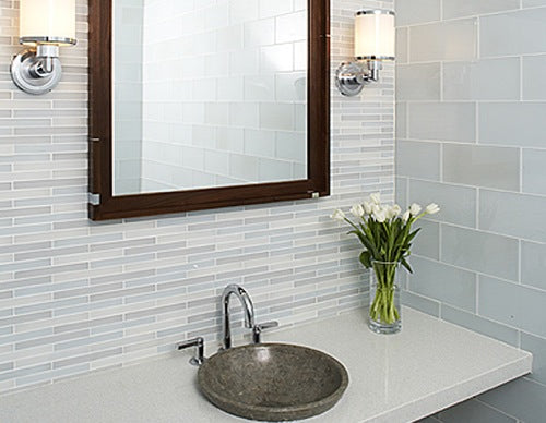 light bathroom with linear glass tile backsplash and large white subway tiles and white roses... Trending in Bathroom Decor: Glass Tile from Bathroom Bliss by Rotator Rod