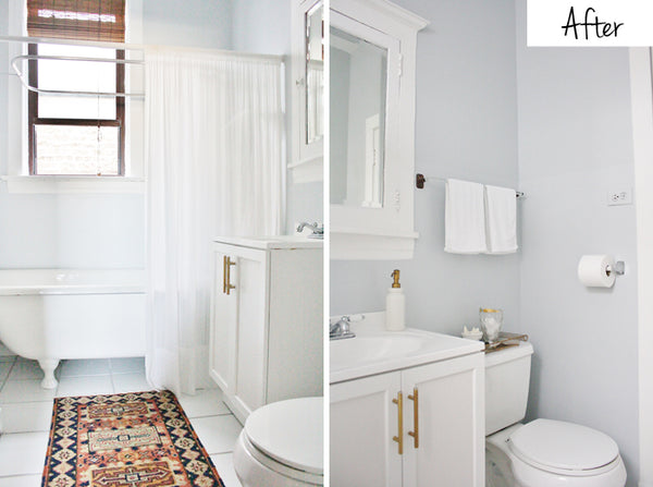clean white bathroom with oriental rug, white shower curtain, white and gold accents... Trending in Home Decor: Winter Bathroom Inspiration from Bathroom Bliss by Rotator Rod 