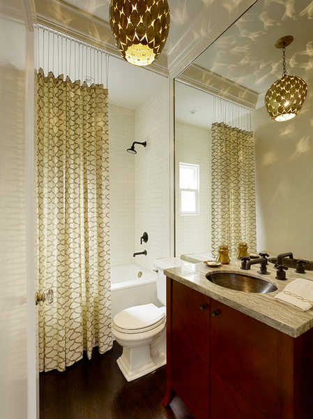 beautiful gold bathroom with contemporary chandelier, tall shower curtain, wood floors, granite countertop... Trending in Home Decor: Winter Bathroom Inspiration from Bathroom Bliss by Rotator Rod 