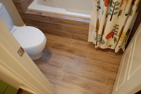 cozy bathroom with wood tile floor and nature shower curtain... Wood Floor Bathroom Inspiration from Bathroom Bliss by Rotator Rod 