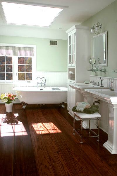classic luxurious bathroom with dark wood floor, mint green walls, claw footed bathtub, white accents, and flowers... Wood Floor Bathroom Inspiration from Bathroom Bliss by Rotator Rod 