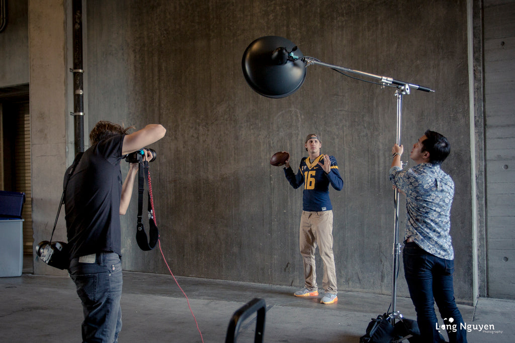 Dustin Snipes photographing Jared Goff