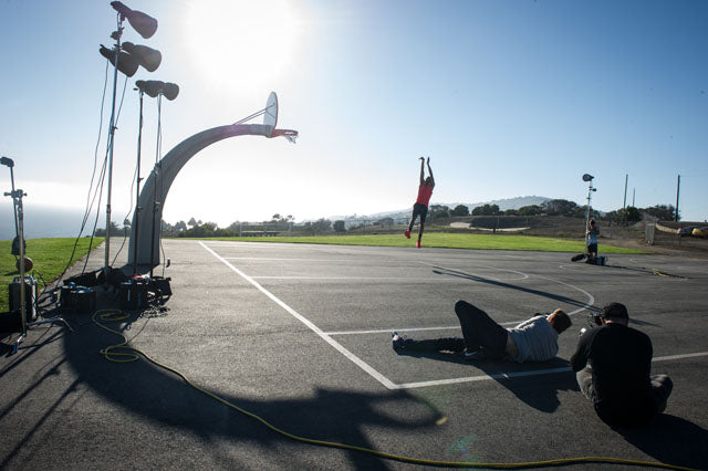 Dustin Snipes photographs Anthony Davis dunking the sun