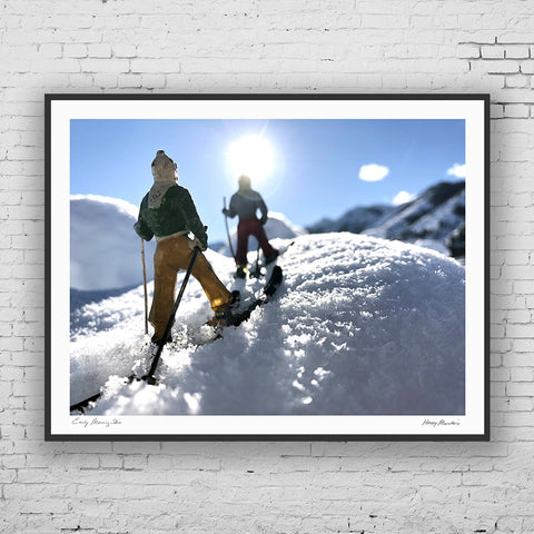 Vintage toy backcountry skiers skinning up Hooey Mountain