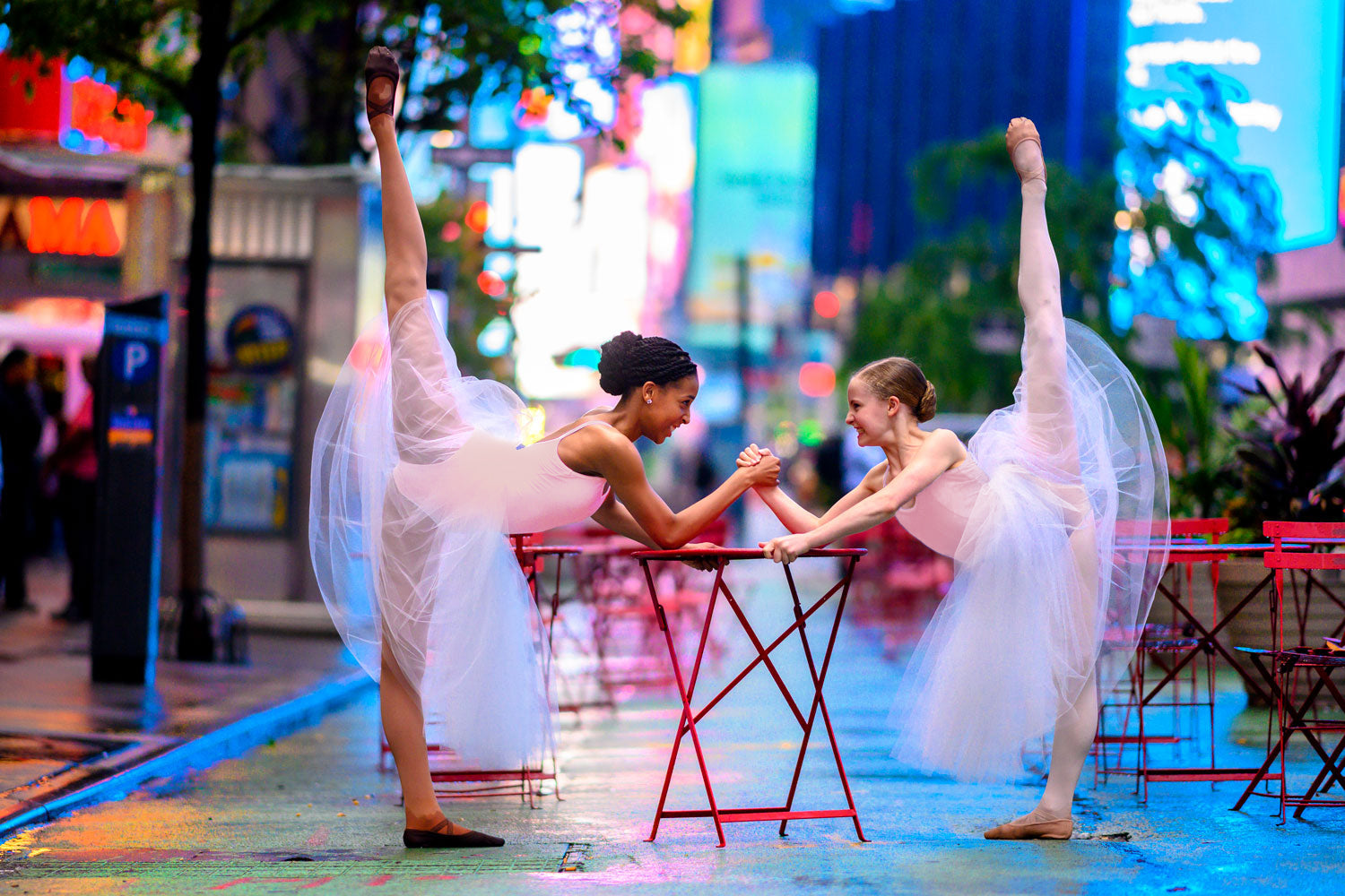 Two young dancers wearing BLOCH tutu and leotard dancing through New York City