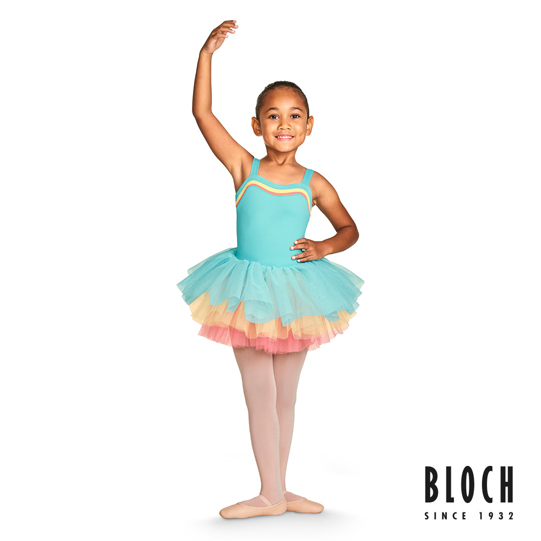 A young ballet dancer dancing wearing the Teagan wide strap leotard with Lenora contrast tutu skirt from the BLOCH Gelato spring collection 