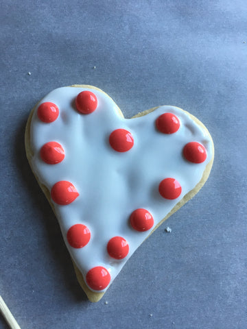 decorating heart sugar cookies with royal icing