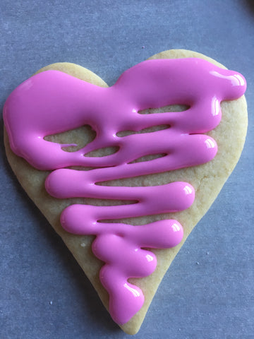 decorating heart sugar cookies with royal icing