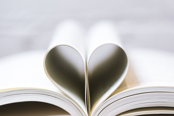 books with pages shaped in a heart